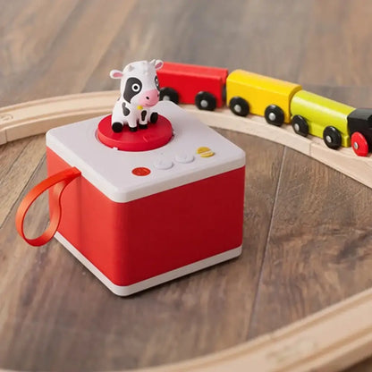 Dando saltos por el Mundo Cuentos Audibles y Canciones FABA dando-saltos-por-el-mundo-dispositivo-rojo-blanco-en-forma-de-cubo-781